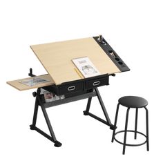 a drawing table with two stools next to it and a book on the desk