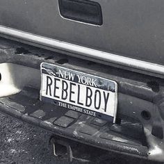 a new york license plate on the back of a car