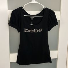 Bebe Women's Black T-Shirt New With Tags Womens Black Tshirt, Bebe Shirt, Bebe Shirts, Silver Shorts, Purple Tee, Sport Tank Tops, Embellished Top, Slim Fit Shorts, Virtual Closet