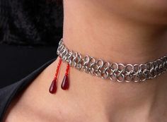 Two deep red trickles of "blood" make this a perfect piece of jewelry to complement a Halloween costume. Or for more frequent wear for the beautiful goths in the world. :)= This choker is sure to turn heads and elicit many comments. Silver color aluminum or stainless steel chainmaille mesh. Vampire Bite, Vampire Bites, Gothic Vampire, Chain Maille Jewelry, Chain Maille, Red Beads, Chain Mail, Halloween Jewelry, Mode Inspo