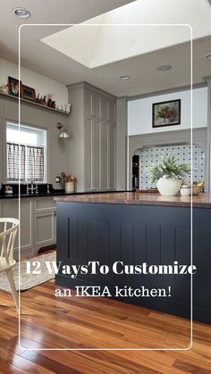 a large kitchen with wooden floors and white cabinets