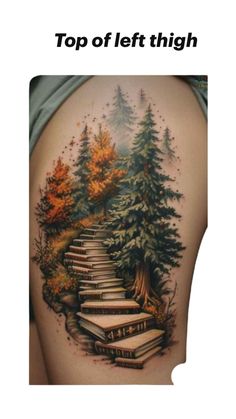 the back of a woman's thigh with books on it and trees in the background