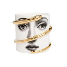 a white and gold ring with a woman's face painted on it