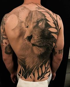 a man with a lion tattoo on his back