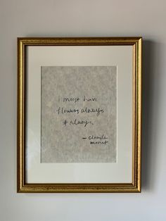 a framed photograph with a quote on the wall above it that reads, i must have known always and always