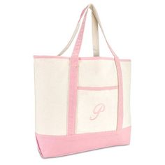 a pink and white canvas tote bag with monogrammed initials on the front