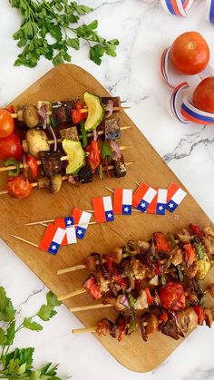 two skewers of food on a cutting board