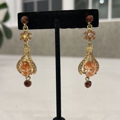 Gorgeous Amuse Chandelier Earrings With Round Topaz, Tear Drop Peach And Gold Crystals. Nwt. Post Earrings. Approximately 2 1/5” Drop. Elegant Orange Chandelier Earrings Gift, Elegant Orange Chandelier Earrings For Gift, Orange Dangle Earrings For Formal Occasions, Elegant Apricot Dangle Earrings, Elegant Apricot Dangle Jewelry, Peach Dangle Earrings For Party, Elegant Peach Dangle Earrings, Orange Teardrop Earrings For Party, Orange Dangle Earrings For Party