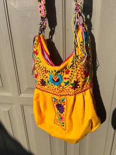 *Please advise each bag has a different belt design and color. If you want a specific design please message us for photos*Beautiful embroidered bag handmade by skilled artisans in Mexico. Each bag is beautifully detailed with a unique color tribal belt and tassels. This bag is very spacious and looks incredible with anything. You will love it!Measurements: 19"W x 13"L x 7" Depth Belt Design, Embroidered Bag, Bag Handmade, Unique Colors, Baby Pink, Pink Blue, Blue And Purple, Blue Black, Tassels