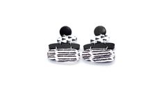 These black and white earrings are a super fun accessory to top off an outfit. Each earring features solid black acrylic charms paired with black and white triangle print and chevron charms. They are the perfect mix of patterns that is far from boring! The earrings are finished off with stainless steel ear posts. MATERIALS Acrylic Stainless Ear Posts LENGTH 2 1/4" CARE Direct contact with perfumes and moisture should be avoided to minimize damage or discoloration. Please remove before showering, Trendy Black Geometric Earrings, Trendy Black Geometric Jewelry, Black And White Earrings, Black Earrings Dangle, Triangle Print, Acrylic Charms, Black Acrylic, White Jewelry, Black Acrylics