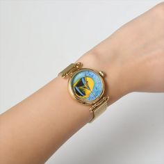 Introducing our exquisite Micro Acrylic Painted Fish Women Watch, a truly one-of-a-kind timepiece that captures the essence of elegance and artistry. The watch features a captivating blue dial adorned with meticulously hand-painted fish motifs, showcasing the creativity and attention to detail put into each piece. #WomenWatch #GoldenWatch #FishWatch #MicroPaintedWatch #HandmadeWatch #HandPaintedWatch #LuxuryWatch #AnalogWatch #QuartzWatch #WaterproofWatch #AcrylicWatch #WomenGift #BirthdayGift Gift Watches With Bracelet Strap And Round Dial, Gift Watch With Bracelet Strap And Round Dial, Gift Watch Accessories With Rotating Bezel And Round Dial, Blue Watches With Bracelet Strap As Gift, Elegant Blue Watch Accessories For Gift, Elegant Blue Watch Accessories As Gift, Round Skeleton Dial Watches As Gifts, Gift Watches With Skeleton Dial, Watch Painting