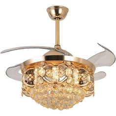 a gold ceiling fan with crystal balls hanging from it's blades and light fixture