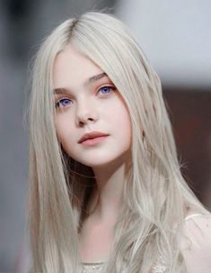 a woman with long blonde hair and blue eyes