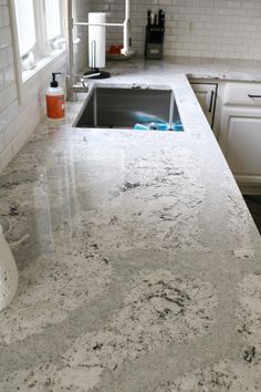 a kitchen counter top with a sink in it