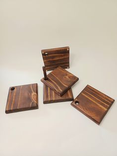 four pieces of wood sitting on top of each other