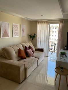 a living room filled with furniture and a flat screen tv