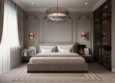 a bedroom with a large bed and chandelier