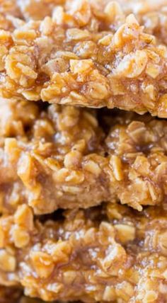 three pieces of oatmeal cookies stacked on top of each other in front of the camera