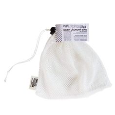 the mesh laundry bag is white and has a black string attached to it, with a tag