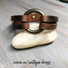 "This beautiful women's leather cuff is handmade with genuine leather. Super easy to put on, snaps with a single snap. No help needed. This leather statement bracelet features a 1\" o-ring. Choose from antique brass, matte nickel, shiny nickel or shiny brass rings and matching hardware. The genuine American tanned leather is 1/2\" wide. It will age beautifully and develops gorgeous character over time. ✦ 100% Handcrafted ✧ 5 Leather & Hardware Options ✦ High Quality Genuine American Tanned L Adjustable Leather Cuff Bracelet With Bracelet Strap, Adjustable Leather Cuff Bracelet With Waxed Finish, Adjustable Leather Strap Cuff Bracelet, Adjustable Cuff Leather Bracelet, Adjustable Vintage Cuff Bracelet With Wrist Strap, Everyday Leather Strap Cuff Bracelet, Adjustable Cuff Bracelet With Wrist Strap For Everyday, Adjustable Wrist Strap Cuff Bracelet For Everyday, Leather Cuff Bracelet For Everyday