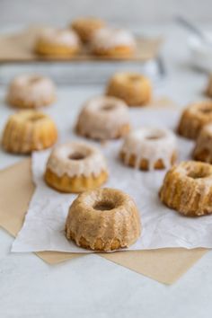 doughnuts sitting on top of parchment paper next to each other