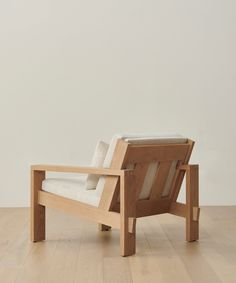 a wooden chair sitting on top of a hard wood floor