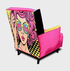 a pink and black chair with an image of a woman on it's back