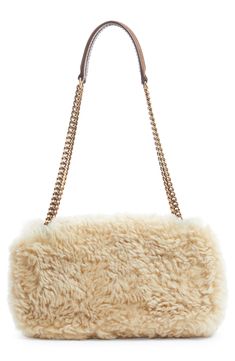 Plush shearling brings a luxurious tactile element to this compact shoulder bag finished with a pull-through strap and branded with a YSL insignia. Magnetic-snap flap closure Pull-through chain-and-leather strap Interior zip pocket Genuine shearling (Iceland) Made in Italy Designer Handbags Luxury Shoulder Bag With Faux Fur Lining, Luxury Sheepskin Bags With Faux Fur Lining, Luxury Leather Shoulder Bag With Faux Fur Lining, Luxury Sheepskin Bag For Everyday Use, Bronze Hardware, Quilted Leather, Clothing Ideas, Chain Bags, Flap Bag