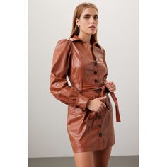 Brown faux leather (100% Polyurethane). Shirt dress. Long sleeves. Collar. Front button closure. 33" from shoulder to hemline. Imported. Trendy Leather Dresses, Fall Mini Dress With Belt And Collar, Fitted Fall Mini Dress With Button Cuffs, Fitted Mini Dress With Button Cuffs For Fall, Fall Formal Leather Dress, Chic Brown Dresses With Button Closure, Fitted Long Sleeve Faux Leather Mini Dress, Leather Belted Dress For Date Night, Trendy Fall Office Mini Dress