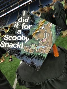 a graduation cap that reads, i did it for a scooby snack