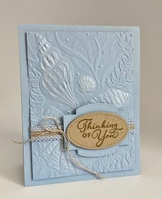 a blue card with a tag that says thank you