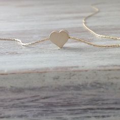 Cute gold necklace with a tiny heart charm hangs on a delicate 14k gold filled chain .This necklace is perfect for yourself, giving as a special gift.Necklace Measures Approximately 17"Tiny heard bead- 7 mmMade from 14k gold filled .If you would like this chain altered, please convo me. All my jewelry are packed in an elegant gift box.If you want to give it as a gift you can specify the address and I'll be happy to send it on your behalf. Dainty 14k Gold Hypoallergenic Charm Necklaces, Minimalist 14k Gold-filled Jewelry With Heart Charm, Dainty Everyday Heart Charm Necklace, Heart Shaped Minimalist Charm Necklace For Best Friend, Dainty Heart Pendant Charm Necklace For Best Friend, Minimalist Heart Charm Necklace For Best Friend, Dainty Heart Charm Necklace For Best Friend Gift, Minimalist 14k Gold Filled Necklaces With Heart Charm, Dainty 14k Gold Filled Charm Necklaces For Everyday