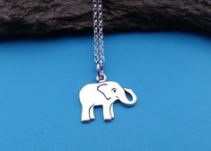 Sterling Silver Baby Elephant Charm Necklace. This playful and cute elephant charm is sure to make you want to venture on a safari, or take a visit to the zoo. This happy elephant is likely to be found traveling in a group, and staying close to it's favorite watering hole. Elephants also symbolize power, strength and good luck. This adorable charm would make a lovely piece of jewelry for the animal lover in your life.  » Sterling Silver  Baby Elephant Charm (16 x 14 x 1" mm including the ring), marked 925 » Sterling Silver Rolo Chain, marked 925 » Your jewelry will come beautifully packaged for gift giving. Personalize It: ✧ Add a Birthstone Crystal: http://etsy.me/2uB37Tu ✧ Add an Initial Charm: http: **PLEASE NOTE** all photos have been enlarged in order to show detail. It is VERY import Elephant Charm Necklace, Happy Elephant, Tiny Elephant, Watering Hole, Elephant Jewelry, Silver Elephant, Silver Elephants, Elephant Necklace, Silver Chain Style