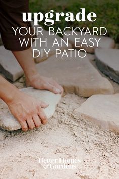 someone is placing sand on the ground with their hand over it and text that reads upgrade your backyard with an easy diy patio