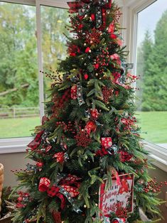 a decorated christmas tree with red and green decorations