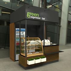 a small display case with food in it for customers to order at the green espresso bar