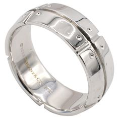 Tiffany & Co. Streamerica 18 Karat White Gold Band Ring Metal: 18k white gold Weight: 12.4 grams Width: 8mm Size: 10.5 (US) Signed: ©2002 Tiffany & Co. 750 Modern White Gold Wide Band, White Gold Polished Wide Band Wedding Ring, White Gold Wide Band With Polished Finish For Wedding, Modern Formal Diamond Cut Bands, Modern Formal Bands With Diamond Cut, White Gold Wide Band Formal Jewelry, Modern Diamond Cut Bands For Formal Occasions, Formal 14k White Gold Open Band Jewelry, 14k White Gold Channel Set Jewelry