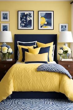 a yellow and blue bedroom with pictures on the wall above the bed, along with two lamps