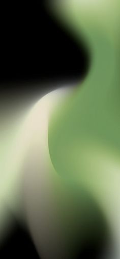 a blurry image of green and white swirls