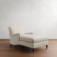 a white chair sitting on top of a wooden floor