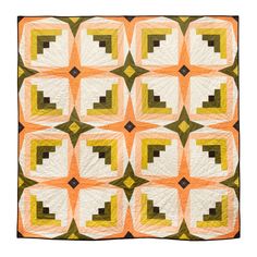 an orange and white quilt with squares in the shape of cubes on top of each other