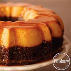 a bundt cake covered in caramel sauce on a white plate