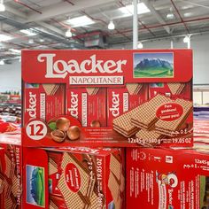 several boxes of crackers stacked on top of each other in a grocery store aisle