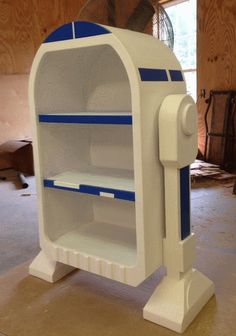 a white and blue display case sitting on top of a table