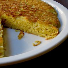 a close up of a pie on a plate with one slice missing from it's crust