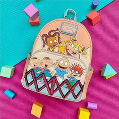 Embrace nostalgia with the Rugrats 30th Anniversary Mini Backpack from Loungefly. This playful bag features beloved characters like Tommy, Chuckie, Lillian, Phillip, Angelica, Susie, and even Spike the dog. Set in the iconic playpen, this design makes for a perfect trip down memory lane. Wear a piece of your favorite 90s cartoon with pride! Crafted from vegan leather (polyurethane), this backpack is both stylish and sturdy. It comes with adjustable shoulder straps for comfort and durable metal h Cute Backpack For Back To School And Theme Park, Back To School Backpack For Theme Park, Playful Backpack For Theme Park, Mickey Mouse Club, Coordinating Patterns, Convertible Crossbody Bag, 90s Cartoons, 90s Cartoon, Lady And The Tramp