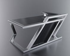 a silver and black object on a gray surface with no one in it or someone else