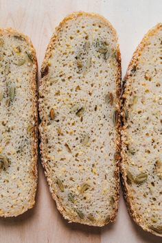 three slices of bread with seeds on them