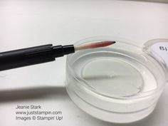 a close up of a lipstick in a container with a marker on it's tip