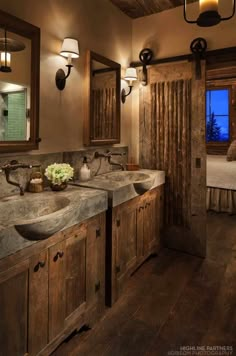 a rustic bathroom with double sinks and wood paneled walls is pictured in this image